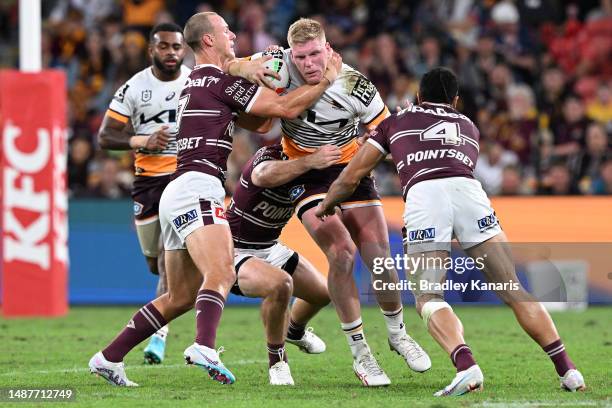 Thomas Flegler of the Broncos is tackled during the round 10 NRL match between Manly Sea Eagles and Brisbane Broncos at Suncorp Stadium on May 05,...