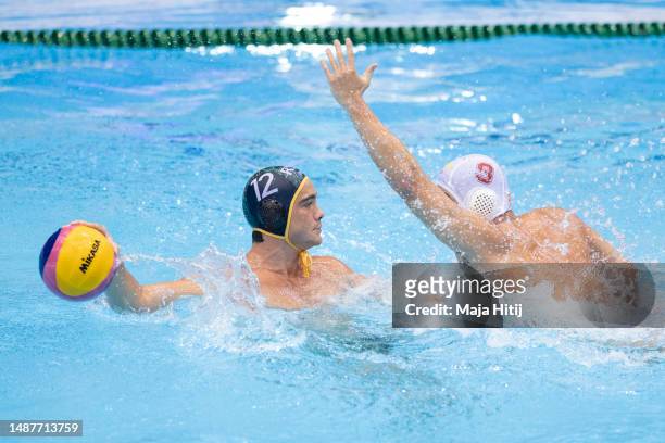 Jonathan Wayne Swanepoel of South Africa in action against Chenghao Chu of China during the World Aquatics Men's Water Polo World Cup Division2...