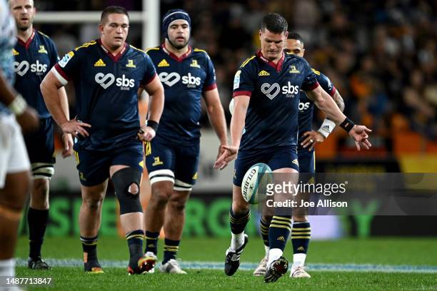 Freddie Burns of the Highlanders kicks for touch during the round 11 Super Rugby Pacific match between Highlanders and Chiefs at Forsyth Barr...