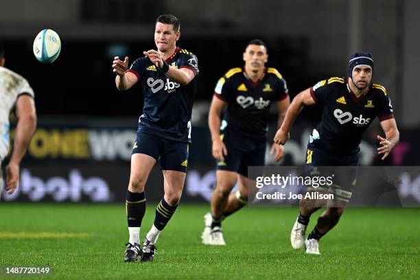 Freddie Burns of the Highlanders receives a pass during the round 11 Super Rugby Pacific match between Highlanders and Chiefs at Forsyth Barr...