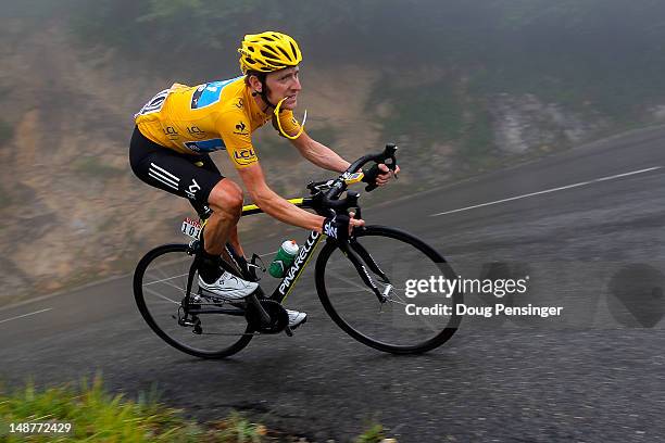 Bradley Wiggins of Great Britain riding for Sky Procycling descends the Col de Mente as he defended the race leader's yellow jersey during stage...
