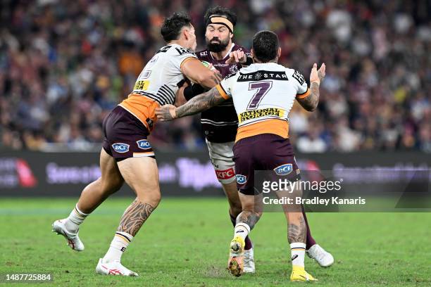 Aaron Woods of the Sea Eaglesis tackled during the round 10 NRL match between Manly Sea Eagles and Brisbane Broncos at Suncorp Stadium on May 05,...