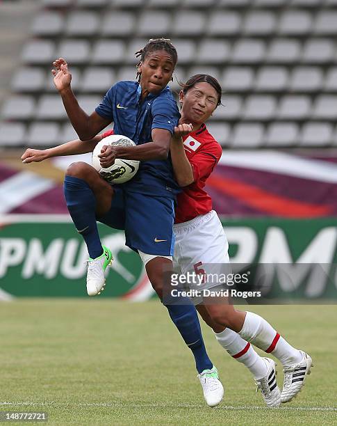 Elodie Thomis of France is challenged by Aya Sameshima during the friendly international match between Japan Women and France Women at Stade Charlety...