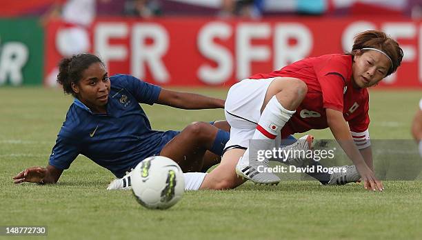 Aya Miyama of Japan is tackled by Laura Georges during the friendly international match between Japan Women and France Women at Stade Charlety on...