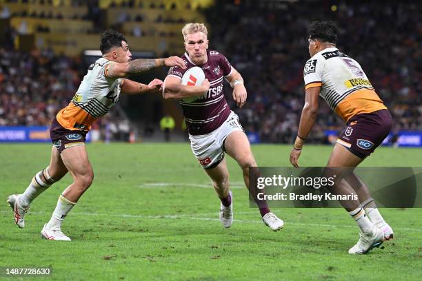 Ben Trbojevic of the Sea Eagles is tackled during the round 10 NRL match between Manly Sea Eagles and Brisbane Broncos at Suncorp Stadium on May 05,...