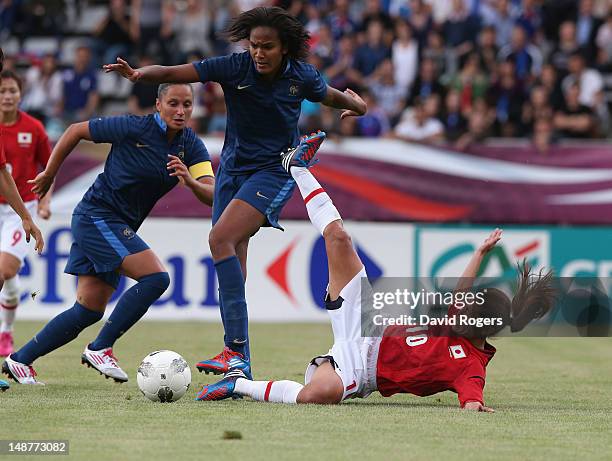 Homare Sawa of Japan is challenged by Wendie Renard during the friendly international match between Japan Women and France Women at Stade Charlety on...