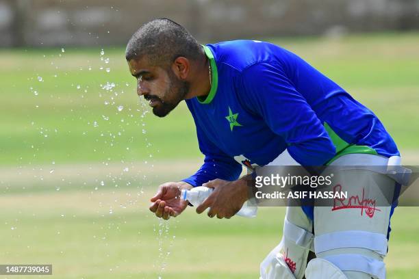 Pakistan's cricket captain Babar Azam cools off during a practice session at the National Stadium in Karachi on July 4 ahead of their tour to Sri...