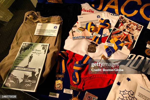 The running shorts, at left, worn by Roberta Gibb when she became the first woman to complete the race, are part of a display at the Boston Athletic...
