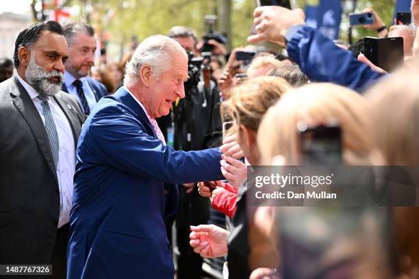 King Charles III greets members of the public along the Mall as preparations continue ahead of the Coronation of King Charles III and Queen Camilla...