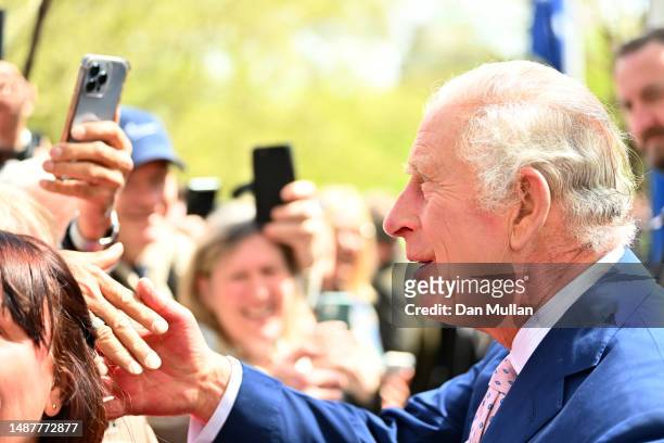 King Charles III greets members of the public along the Mall as preparations continue ahead of the Coronation of King Charles III and Queen Camilla...