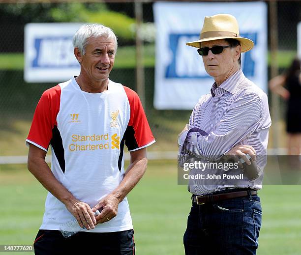 John W Henry principal owner of Liverpool talks with former player Ian Rush during a training session at Harvard University on July 19, 2012 in...