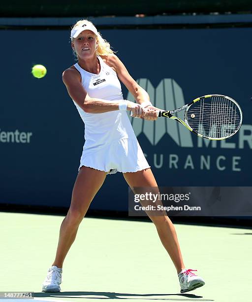 Urszula Radwanska of Poland returns to Melanie Oudin during day six of the Mercury Insurance Open Presented By Tri-City Medical at La Costa Resort &...