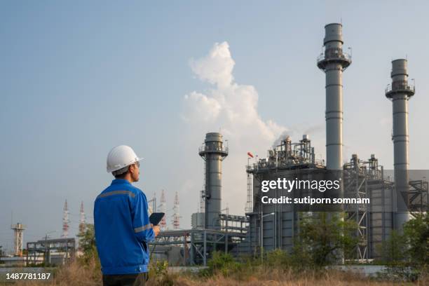 engineer working at gas turbine electrical power plant - gas turbine electrical power plant stock pictures, royalty-free photos & images
