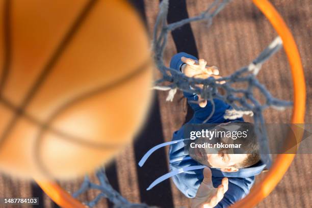 basketball player taking a shot at the basketball hoop - top view - ring toss bildbanksfoton och bilder