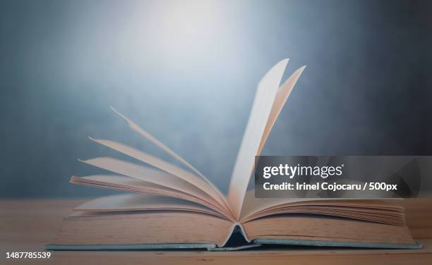 book opening on table education and learning concept,romania - open romania stock pictures, royalty-free photos & images