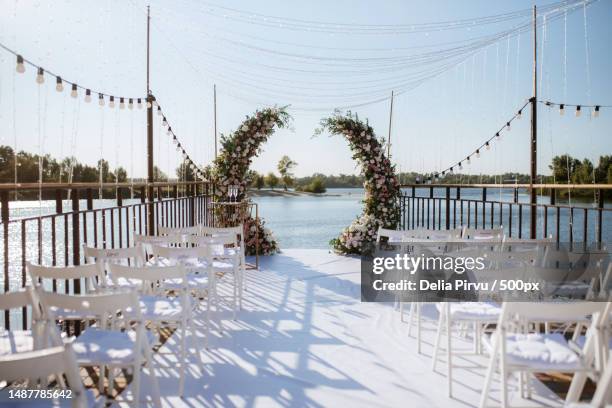 empty chairs and tables at beach against sky,romania - empty wedding ceremony stock pictures, royalty-free photos & images