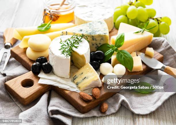 various types of cheese on a white wooden background,romania - cheese board imagens e fotografias de stock