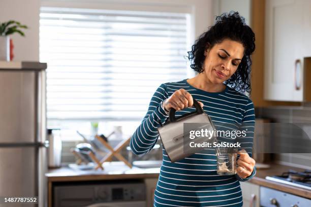 preparing a cup of tea at home - kettle stock pictures, royalty-free photos & images