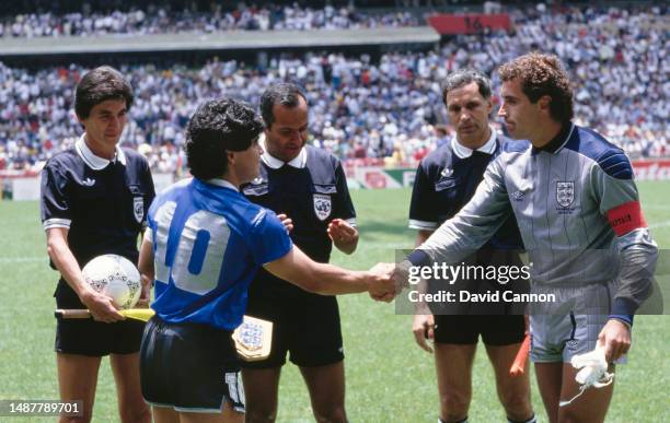 Diego Maradona of Argentina shakes hands with Peter Shilton of England under the watching eye of referee Ali Bin Nasser before the 1986 FIFA World...