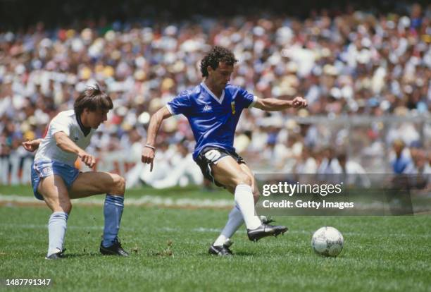 Jose Luis Cuciuffo of Argentina holds off the challenge of England striker Peter Beardsley during the 1986 FIFA World Cup Quarter Final on 22 June...
