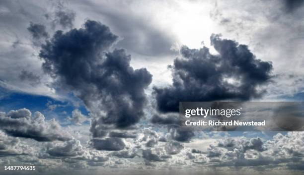 dark clouds - storm clouds sun stock pictures, royalty-free photos & images