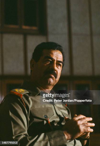 Iraqi army general and politician Saddam Hussein , 5th President of Iraq, is interviewed by a journalist from Time magazine in Baghdad, capital of...