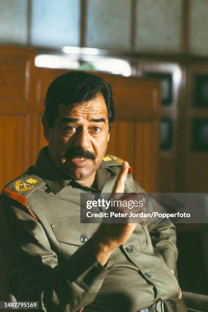 Iraqi army general and politician Saddam Hussein , 5th President of Iraq, is interviewed by a journalist from Time magazine in Baghdad, capital of...