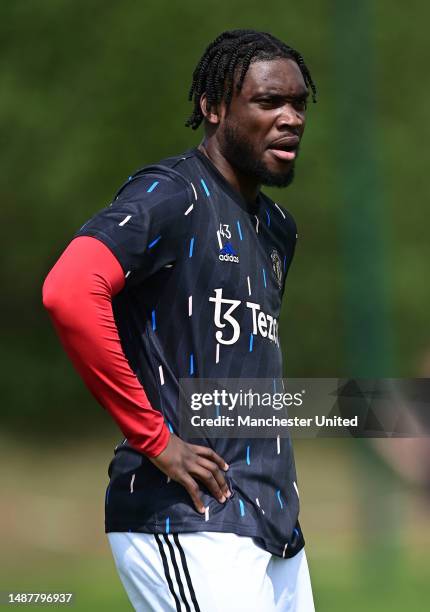 Teden Mengi of Manchester United warms up prior to the Premier League 2 match between Manchester United and Leicester City at Carrington Training...