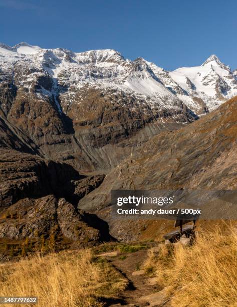 scenic view of snowcapped mountains against clear sky - andy dauer stockfoto's en -beelden