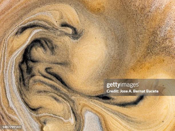 full frame, textures of the crema from a cup of freshly brewed espresso. - crema stock pictures, royalty-free photos & images