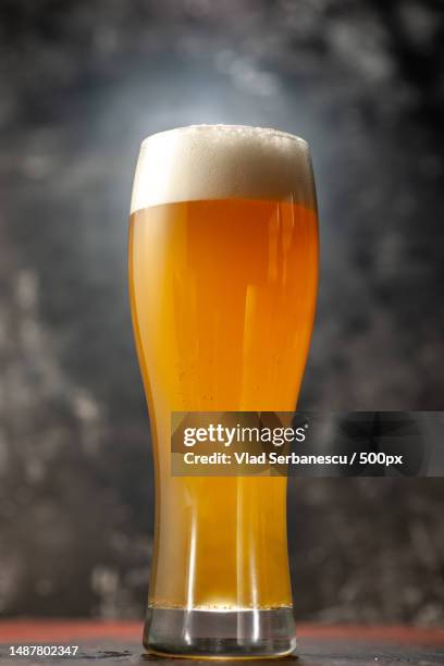 front view glass of bear on a light background snack wine photo drink color alcohol - cerveza-tipo-ale fotografías e imágenes de stock