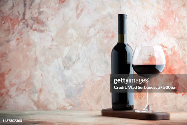 front view glass of wine with bottle and chocolate on light background alcohol bar champagne juice drink lemonade - wine bottle stock pictures, royalty-free photos & images