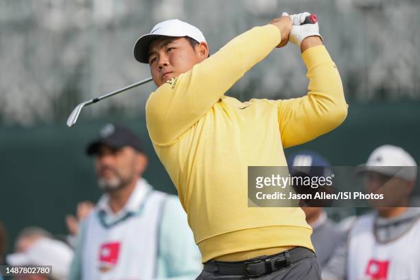 Tom Kim of Korea watches his tee shot on the 17th hole during Round Two at the Wells Fargo Championship at Quail Hollow Club on May 5, 2023 in...