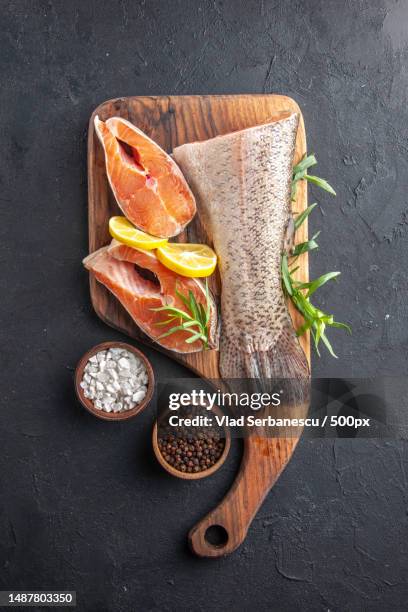 top view fresh fish slices with lemon on dark background color water meat food ocean dinner meal seafood health - calzature color carne foto e immagini stock