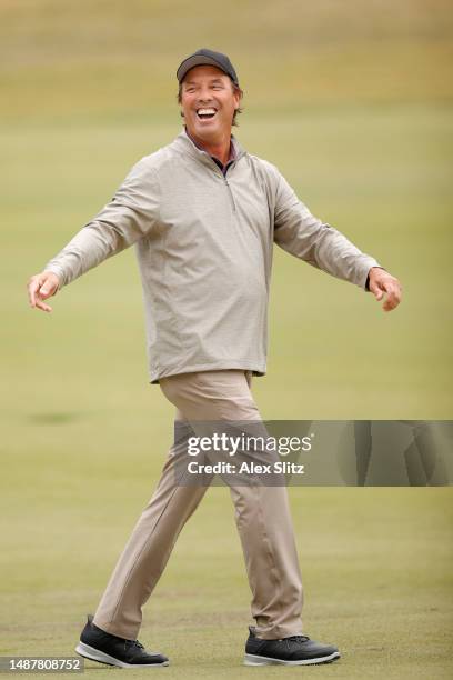 Stephen Ames reacts while reaching for a club on the 10th fairway during the first round of the Mitsubishi Electric Classic at TPC Sugarloaf Golf...
