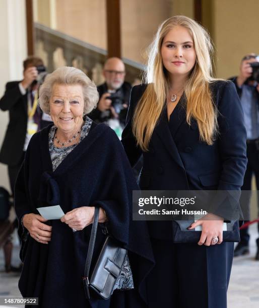 Catharina-Amalia Beatrix Carmen Victoria and Beatrix of the Netherlands attend the Coronation Reception for overseas guests at Buckingham Palace on...