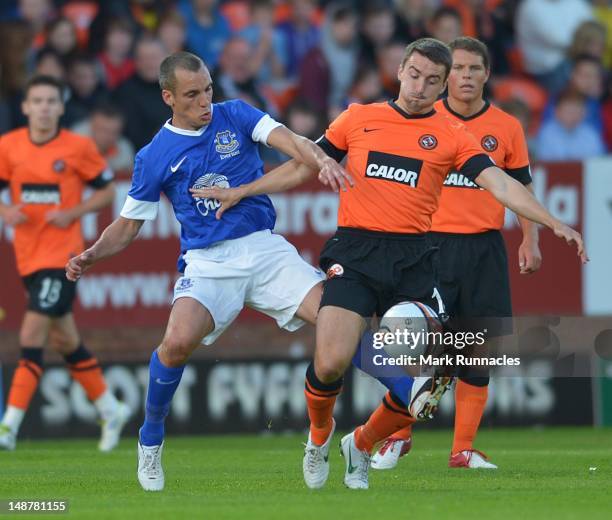 Leon Osman of Everton in action with Mark Miller of Dundee United during the pre-season friendly match between Dundee United and Everton at Dens Park...