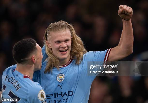 Erling Haaland of Manchester City celebrates scoring with team mate Phil Foden during the Premier League match between Manchester City and Arsenal FC...