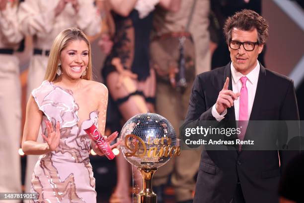 Hosts Victoria Swarovski and Daniel Hartwich are seen on stage during the 10th "Let's Dance" show at MMC Studios on May 05, 2023 in Cologne, Germany.