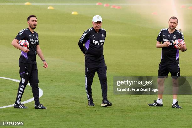 Carlo Ancelotti, manager of Real Madrid and his staff members interact during the Training session at Estadio de La Cartuja on May 05, 2023 in...