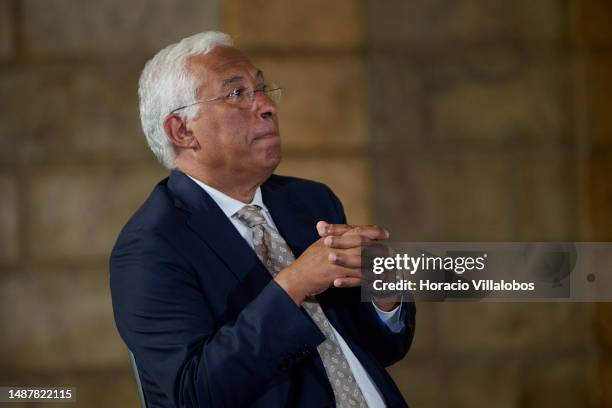Portuguese Prime Minister Antonio Costa sits onstage during the ceremony in which Mozambican Paulina Chiziane, author of novels and short stories in...