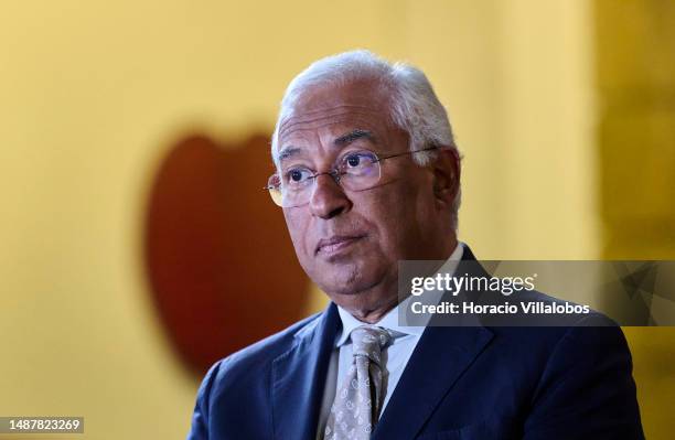 Portuguese Prime Minister Antonio Costa sits onstage during the ceremony in which Mozambican Paulina Chiziane, author of novels and short stories in...