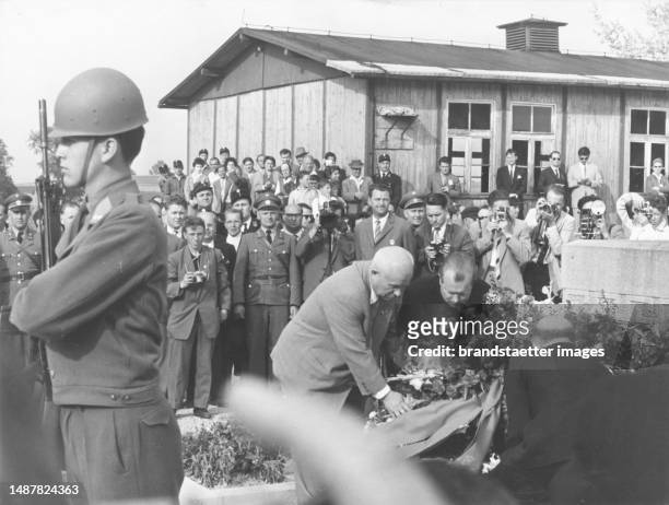 During his state visit to Austria Soviet Prime Minister Nikita Khrushchev visits the former Mauthausen concentration camp and lays three wreaths for...