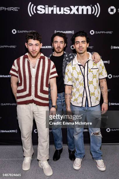 Nick Jonas, Kevin Jonas and Joe Jonas of the Jonas Brothers pose at the SiriusXM Miami Studios, presented by Chase Sapphire on May 05, 2023 in Miami...