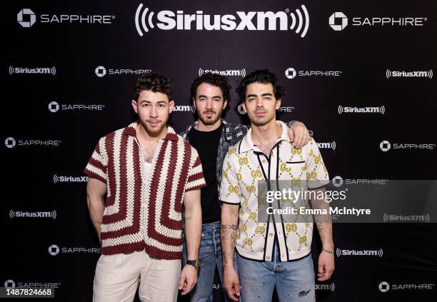 Nick Jonas, Kevin Jonas and Joe Jonas of the Jonas Brothers pose at the SiriusXM Miami Studios, presented by Chase Sapphire on May 05, 2023 in Miami...