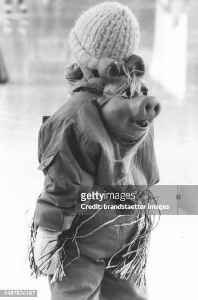 Girl with Miss Piggy mask at the carnival festival of the Vienna Ice Skating Club. Vienna. 4 February 1988.