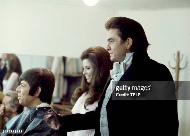 American singer Bobby Goldsboro, American singer, songwriter and dancer June Carter Cash and her husband, Country singer Johnny Cash talk in the...