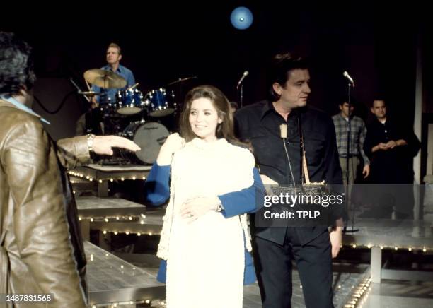 American singer, songwriter and dancer June Carter Cash receives a white dress with her husband, Country singer Johnny Cash during an episode of The...