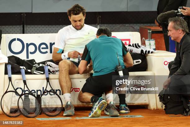 Aslan Karatsev receives medical treatment against Jan-Lennard Struff of Germany during the Men's Singles Semi-Final match on Day Twelve of the Mutua...