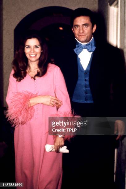 American singer, songwriter and dancer June Carter Cash and her husband, Country singer Johnny Cash poses for a portrait circa 1970 in New York, New...